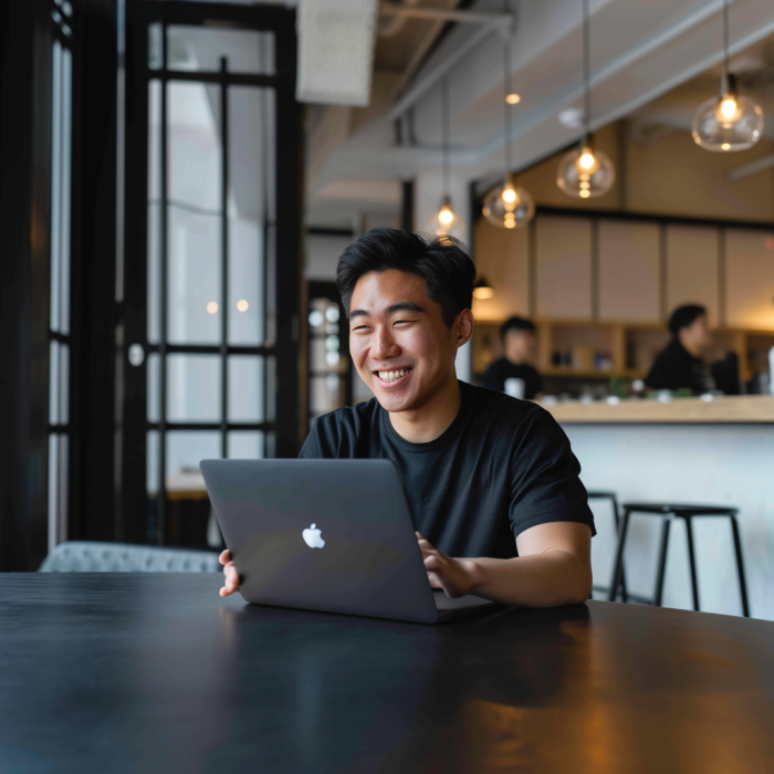 A man on a laptop making estimated tax payments