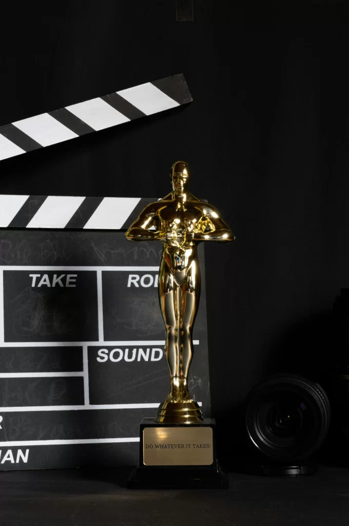A picture of an Oscars trophy with a camera
