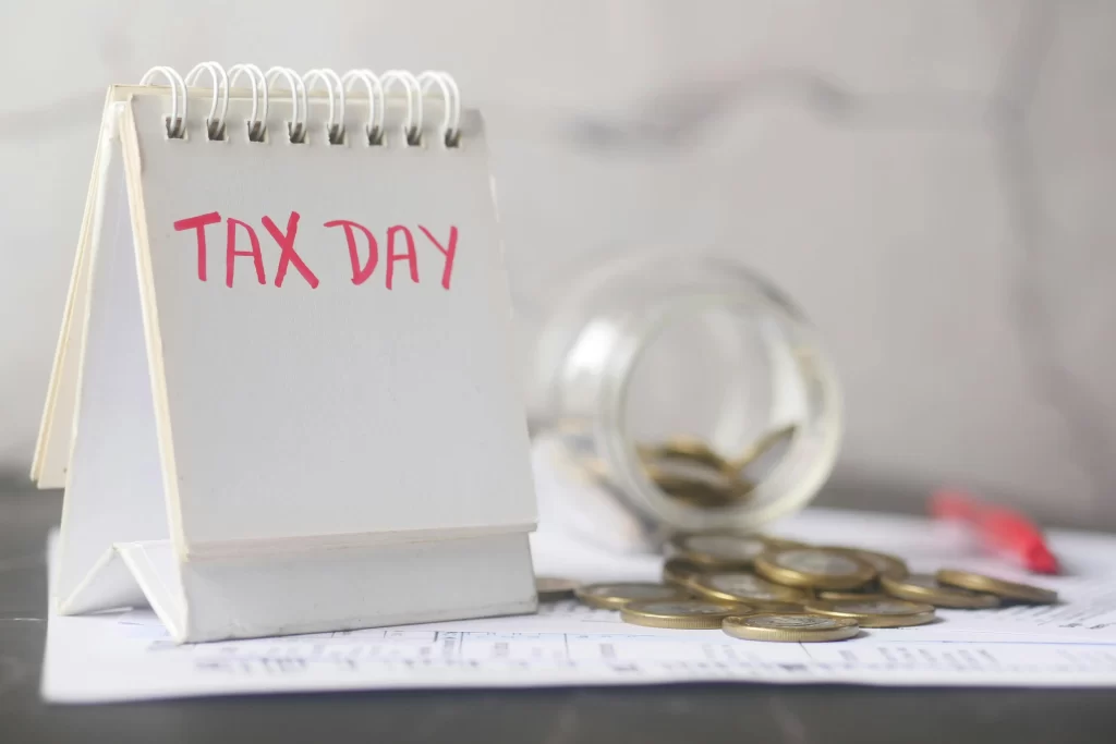 A picture of a notebook that says 'tax day'