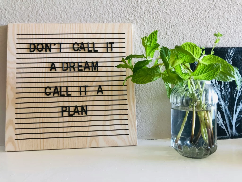 A sign that says 'don't call it a dream, call it a plan'